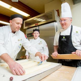 Baking students working together, 