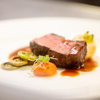 Gourmet plate of beef with vegetables and sauce. 